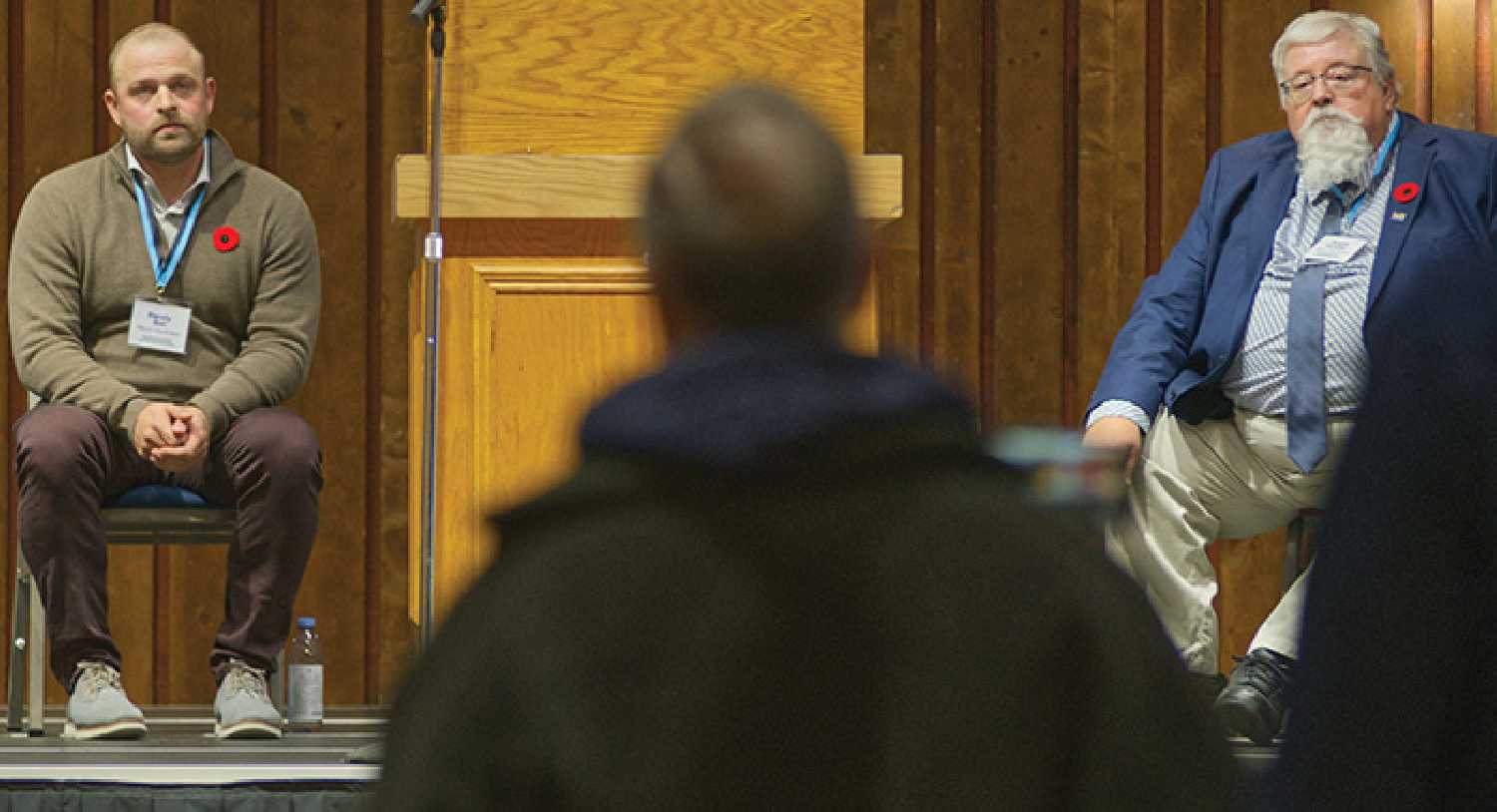 Randy Bot, left, and Grant Forster, right listening to a resident ask a question.